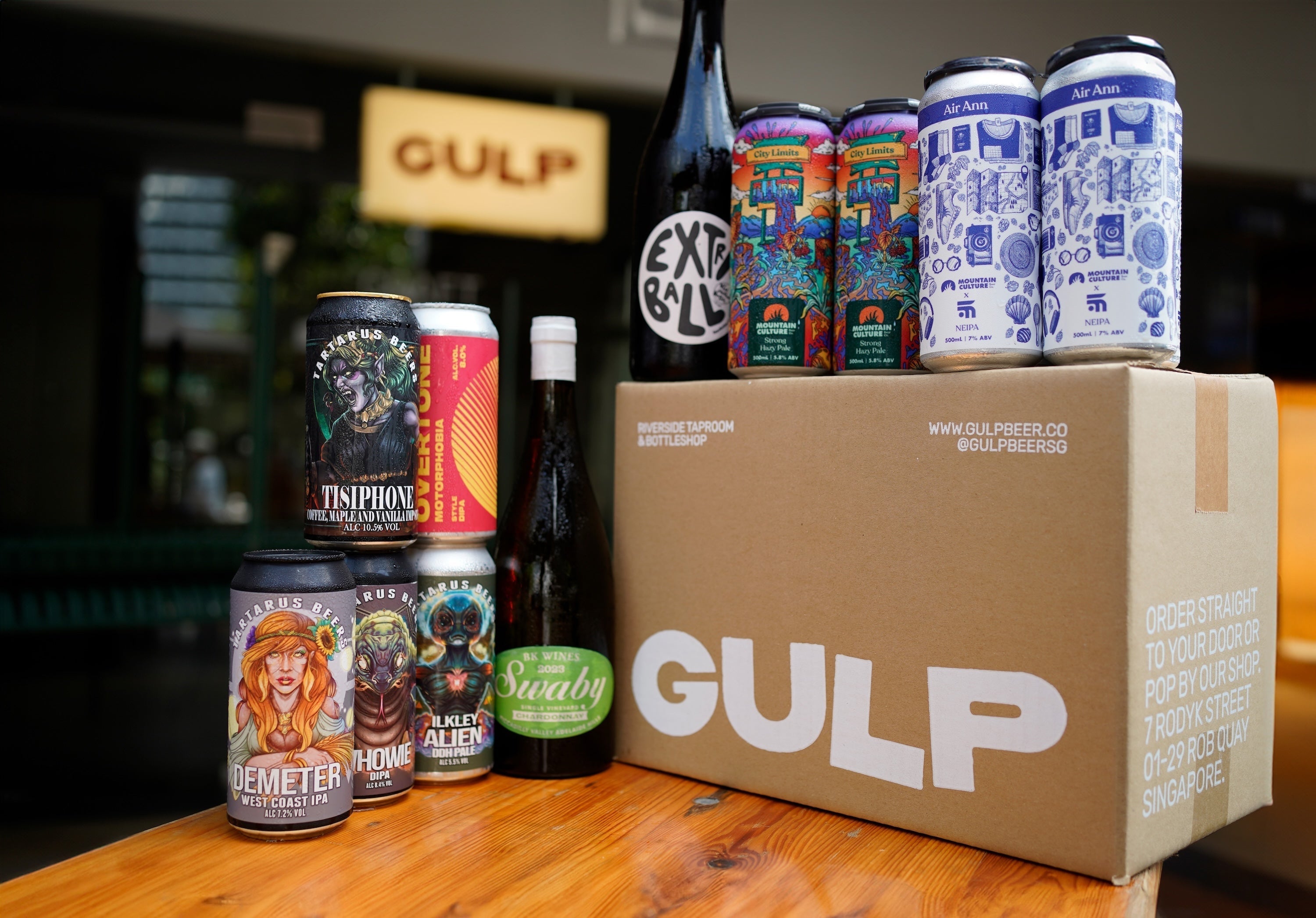 Beer cans and a GULP delivery box on a table