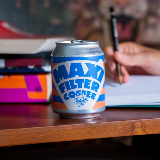 Can of maxi filter coffee on desk